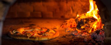 pizza in a brick oven