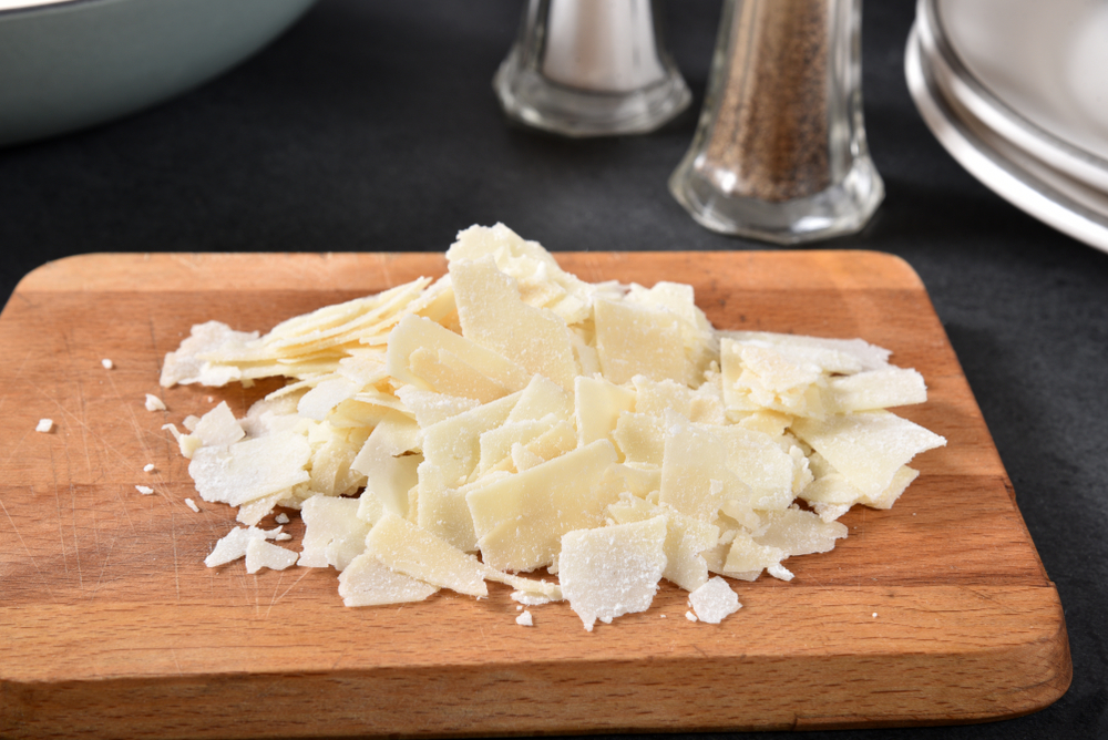 Slice Asiago Cheese on Board