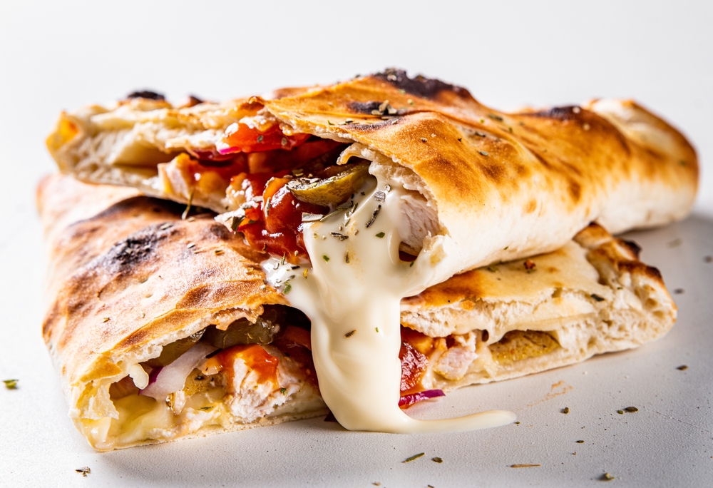 Calzone pizza folded in half with meat