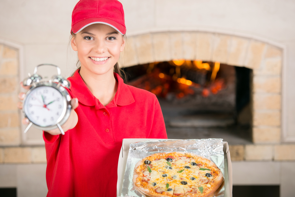 Delivery Woman With Delicious Pizza in box