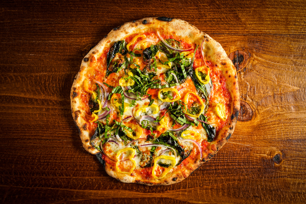 Pizza with spinach and banana peppers
